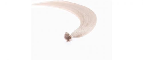 A white hair extension is shown with a flower.