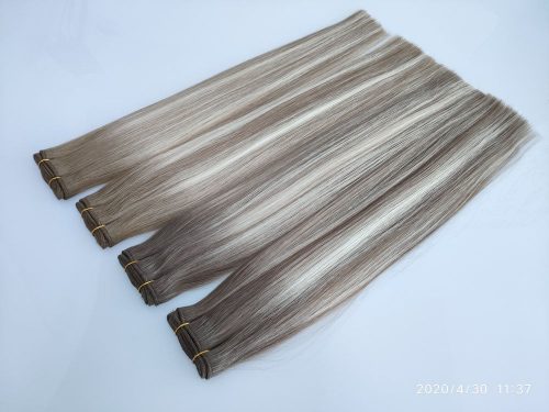 A bunch of hair extensions laying on top of each other