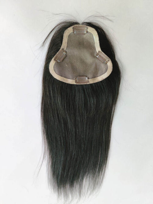 A black wig is shown with a piece of hair.