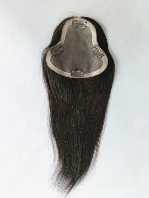 A wig is shown with long hair on top of it.